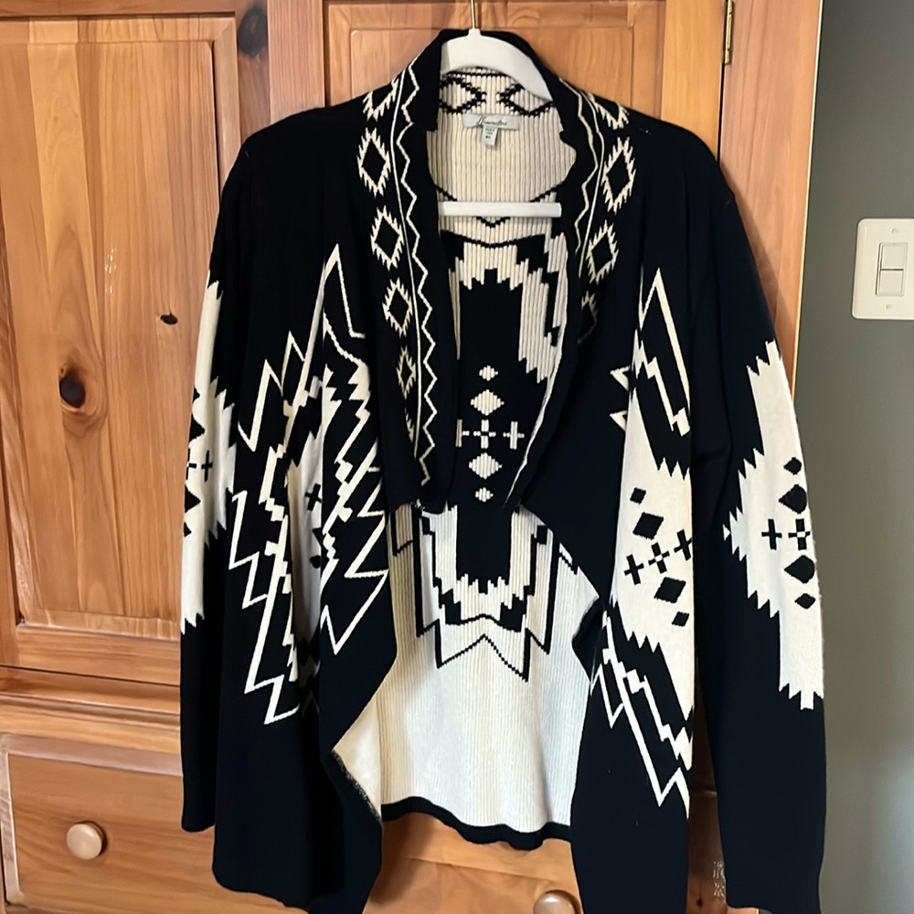 Illuminative black and cream colored gorgeous sweater.  Never worn.